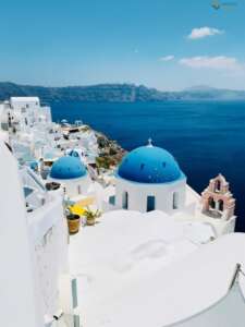 Firostefani, the “crown of Fira”, is our next destination. White-painted traditional houses, narrow paths and the iconic Blue Dome Church, symbol of the island, will reward visitors with their charm and beauty.